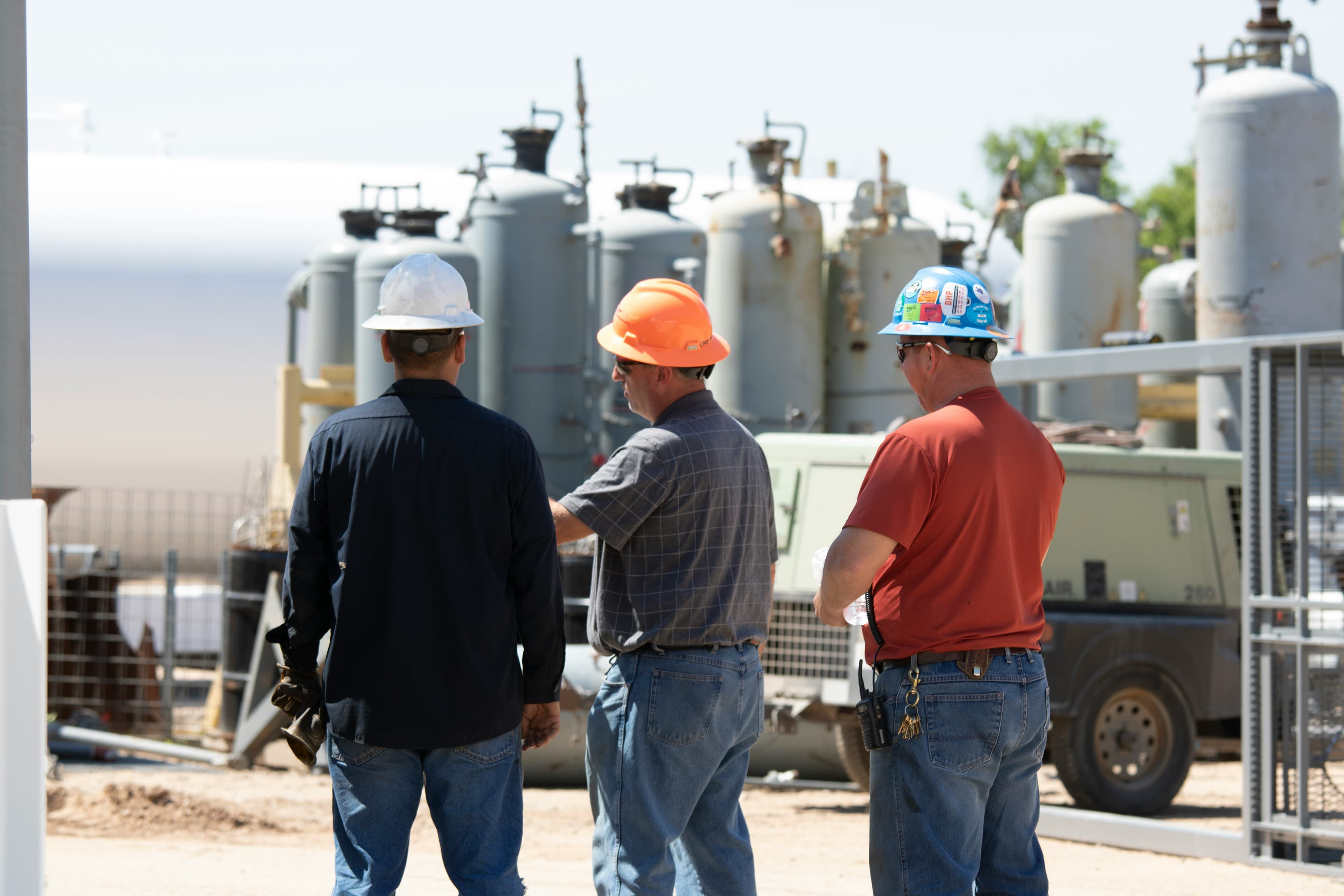 Professionals reviewing operations at an energy facility